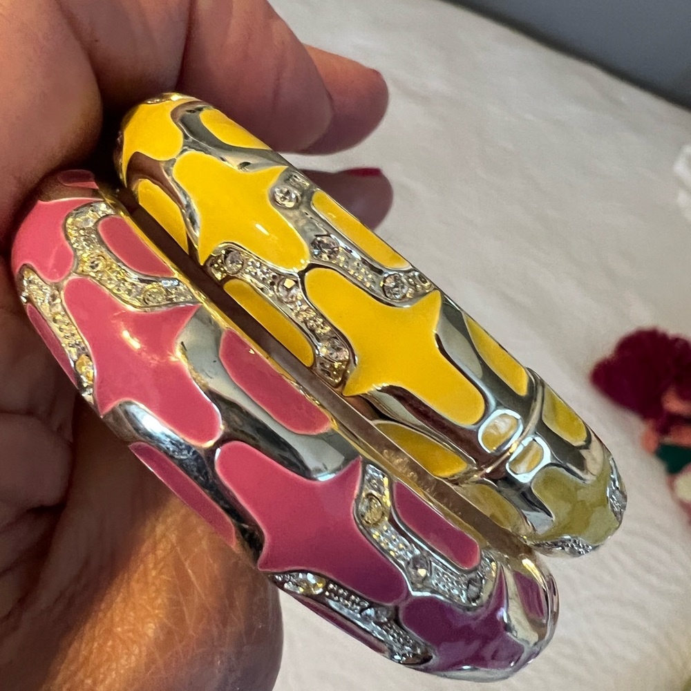 Two metal/enamel bracelets with hinge. Never worn. Beautiful colors.